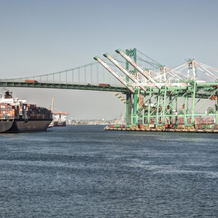 Huge container ship under the historic Vincent Thomas Bridge in San Pedro (Port of Los Angeles)